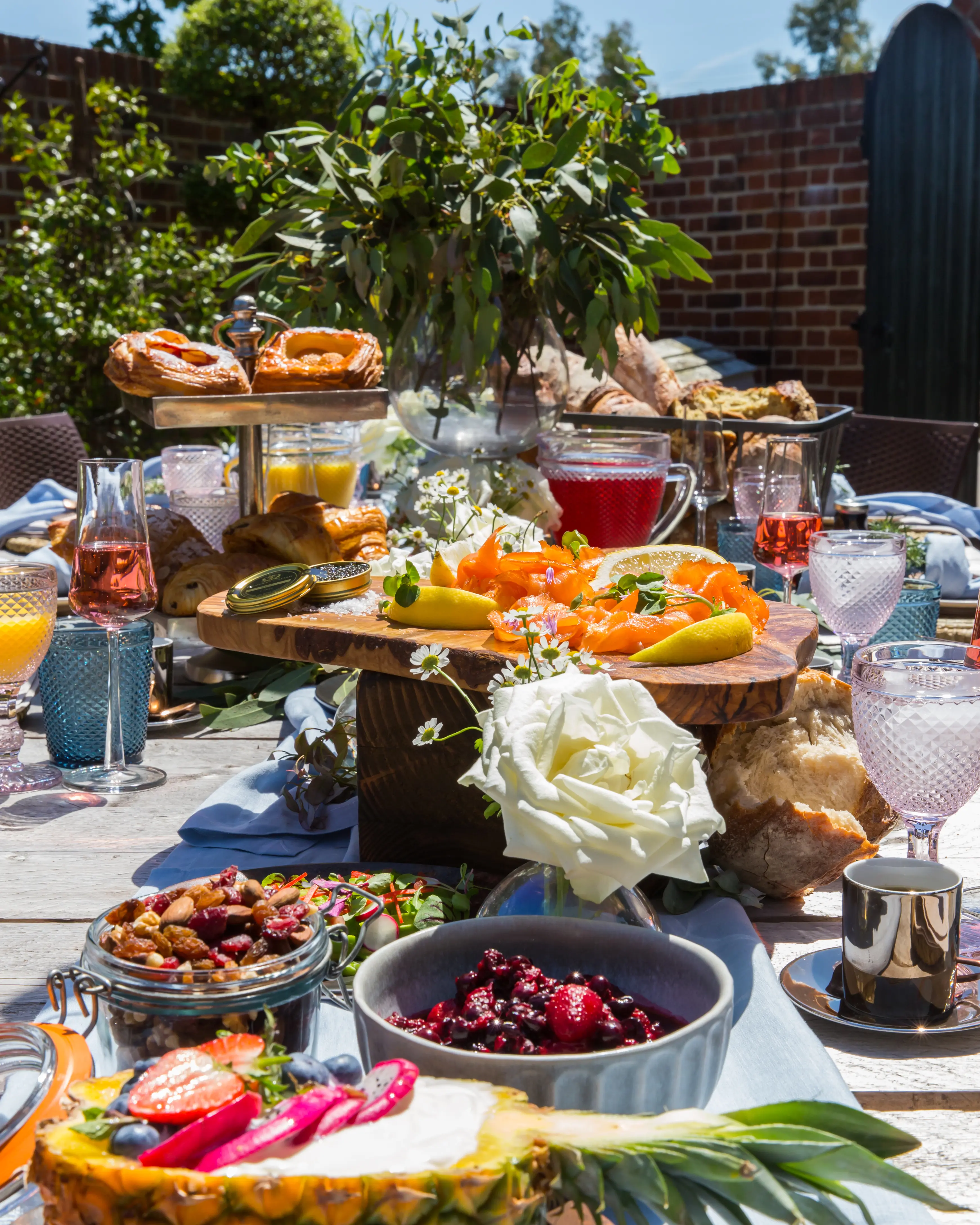 Long table dressed & set for large group.